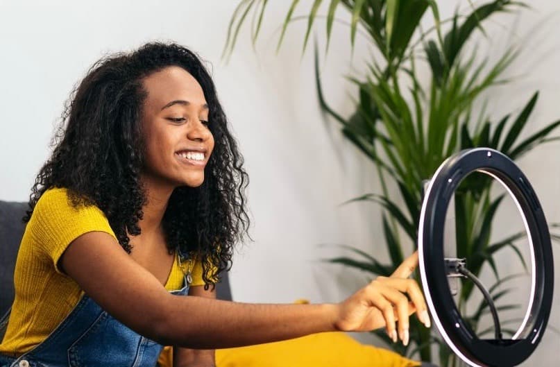 Job Seeker recording a video pitch with ring light